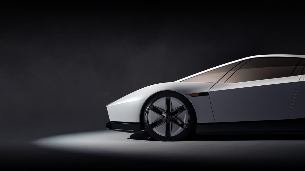 Tesla Roadster сбоку в тёмной студии